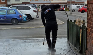 Pressure cleaning concrete driveway